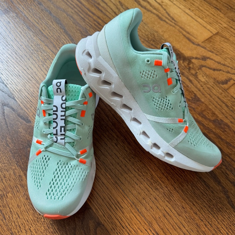 On Running Athletic Shoes in Mint Green and Orange